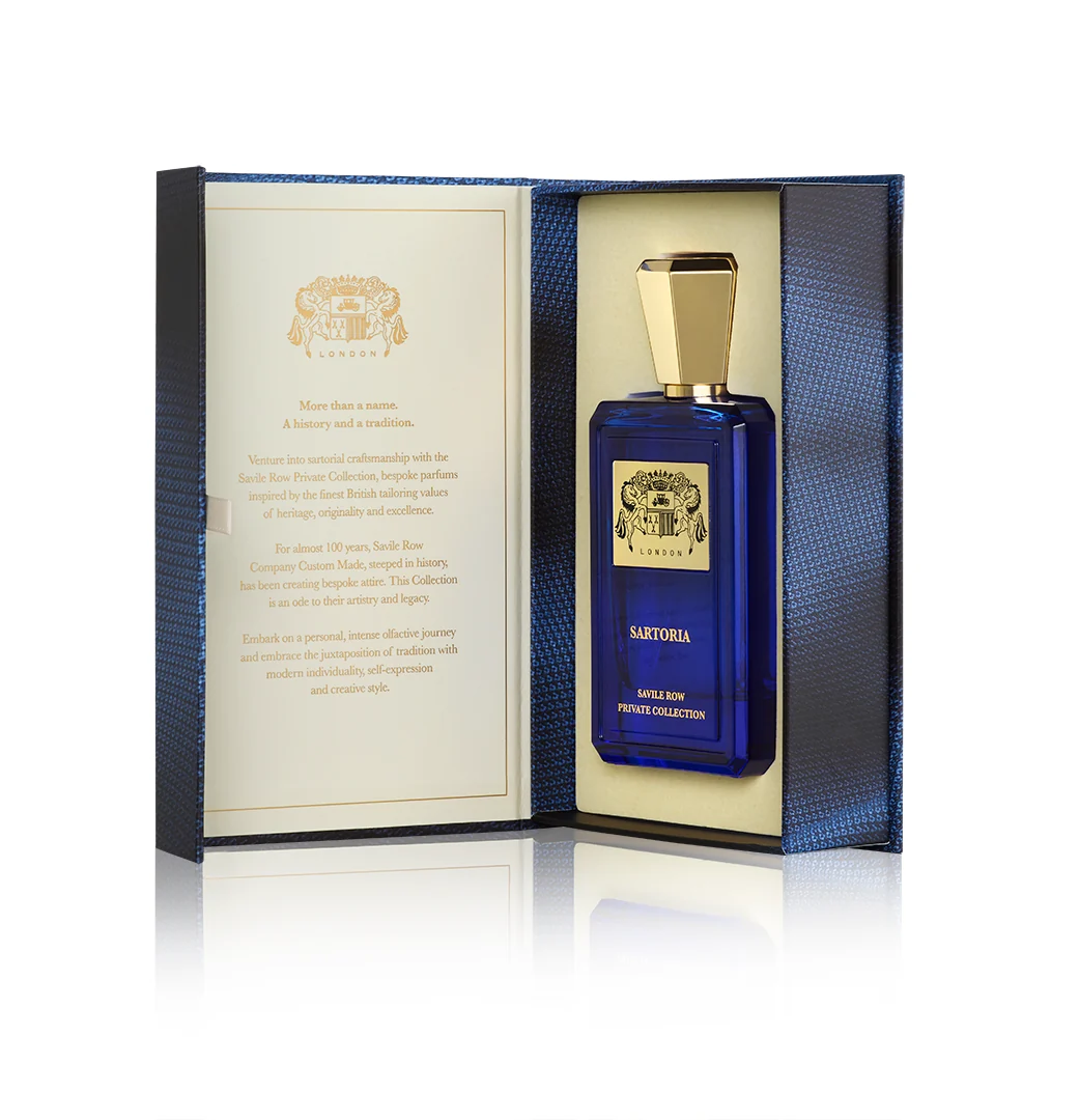 The Sartoria presentation box opened to show the printed inner leaf beside the blue glass bottle