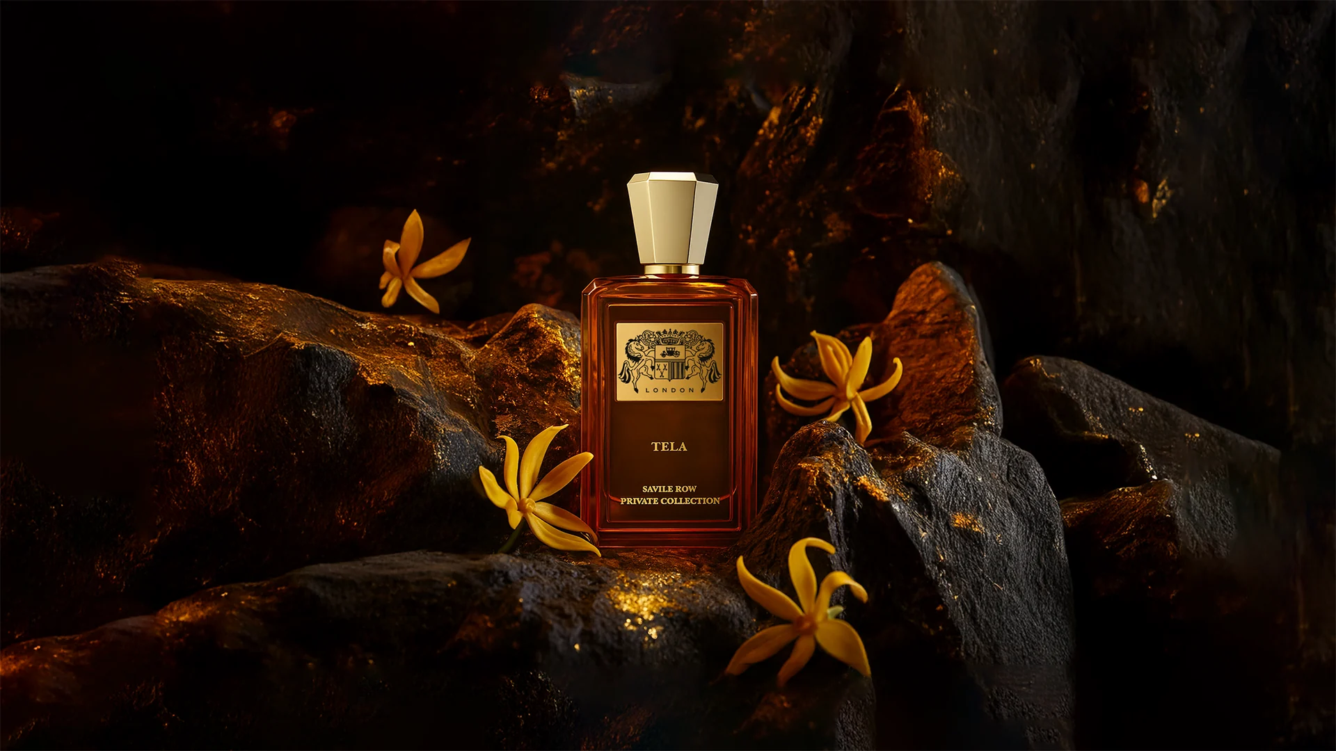 Tela Extrait de Parfum on dark rock, strewn with ylang-ylang flowers